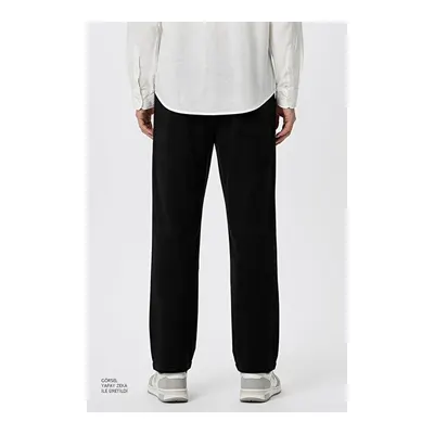 Jogger Slim Fit Dar Kesim Yan Cepli Beli Bağlamalı Siyah Pantolon